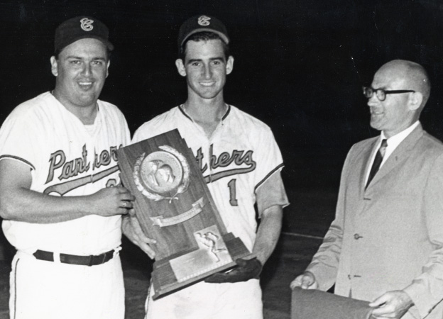 Coach Paul Deese (left) and captain Robert Zamora - both inducted into the Chapman Hall of Fame - accept the 1968 NCAA National Championship trophy.