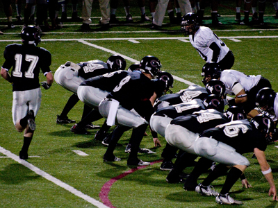 Football team making video of support to send troops for the holidays