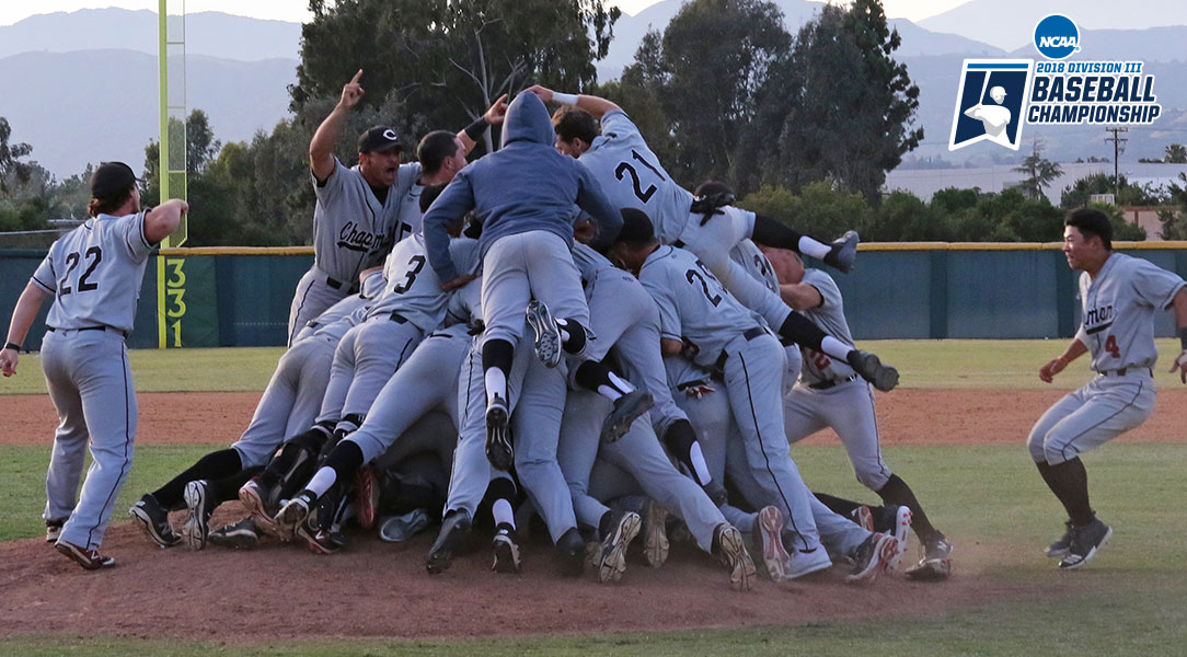 The baseball team dog piles on the mound.