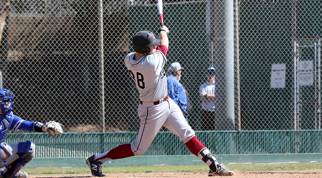 Mack Cheli swings at the ball.