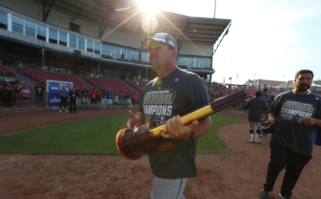 Scott Laverty carries the national championship trophy.