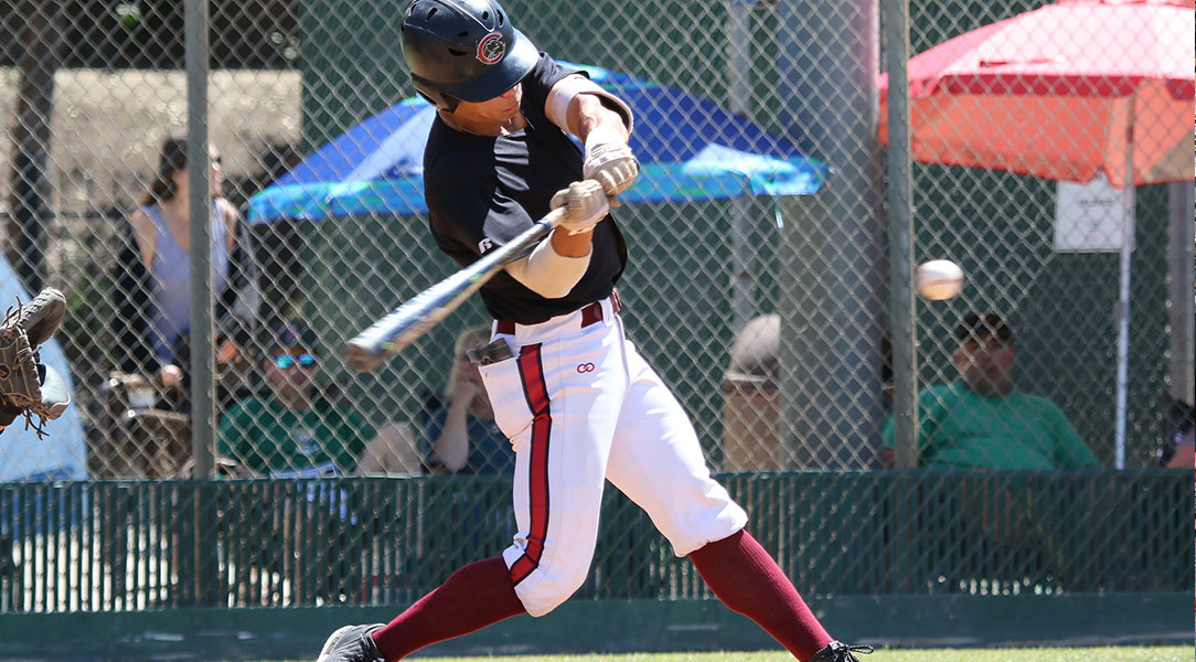 Alex Tsuruda hits the ball.