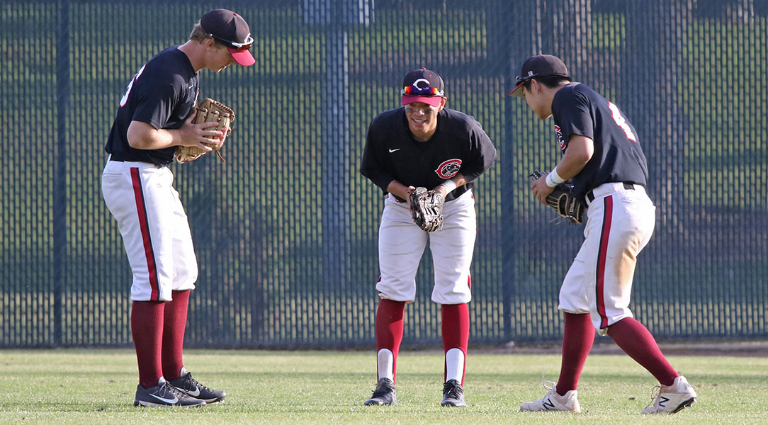 The outfielders celebrate a win.