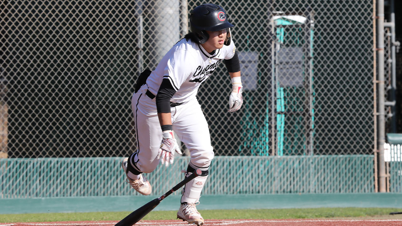 Cole Minato runs to first after hitting a single.
