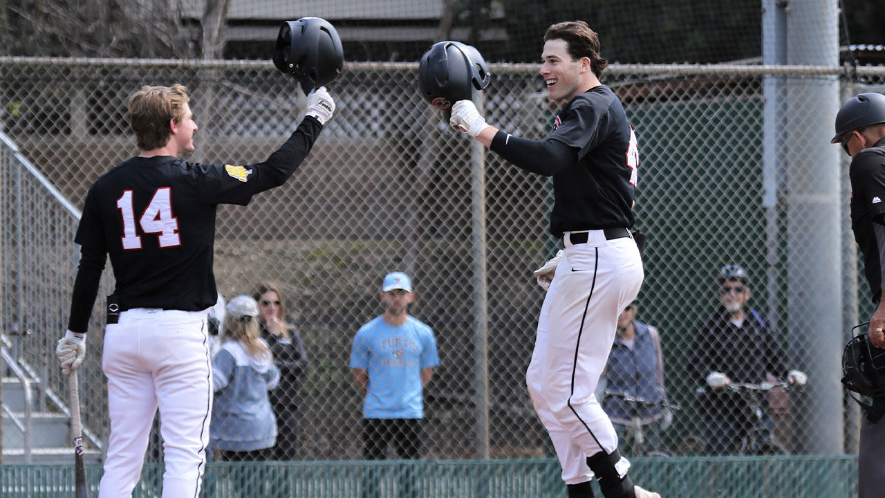 Ryan Nopper meets Josh Phillips at home plate after Phillips hit a home run.