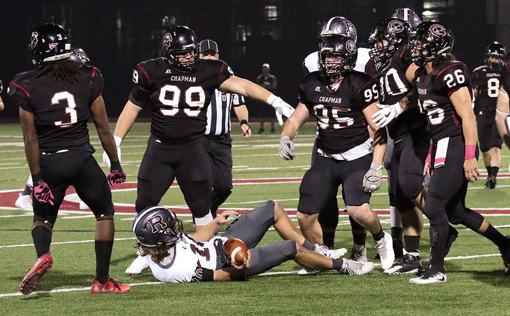 The defense celebrates a big play (photo by Larry Newman)