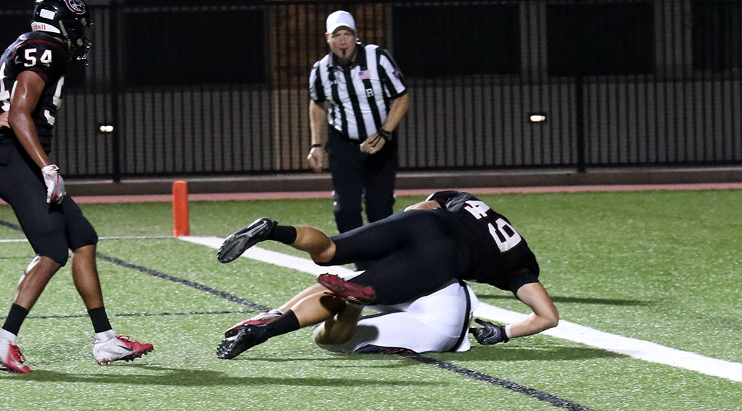Ben Bruce tackles the punter for a safety.
