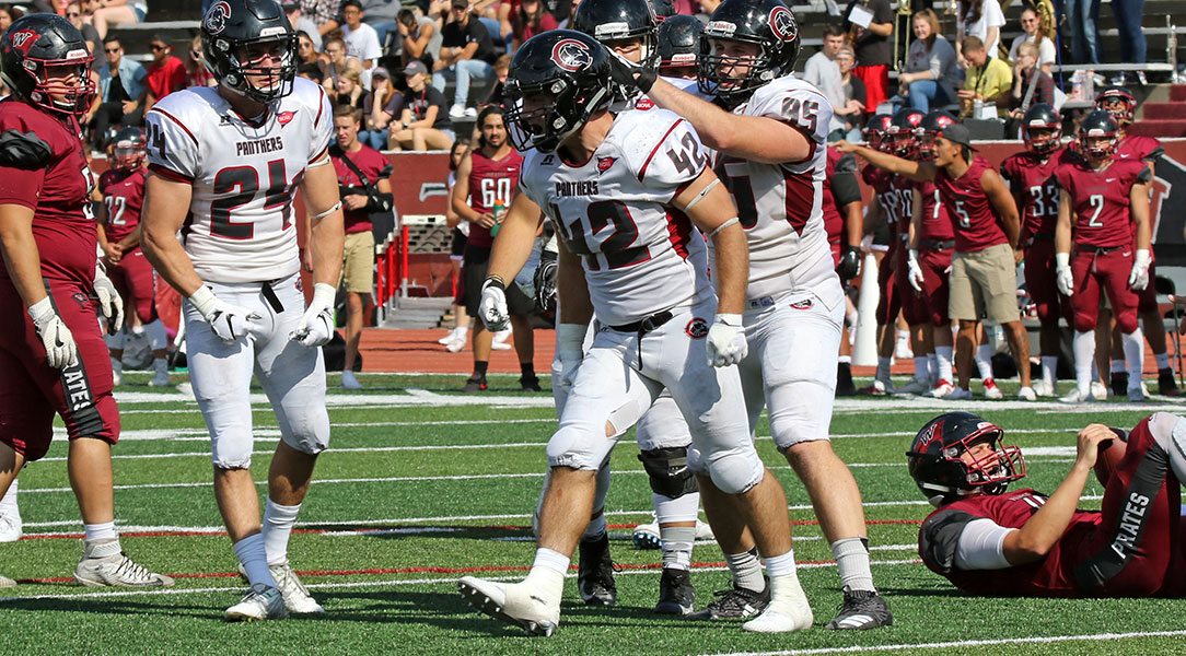 Curt Calomeni celebrates a tackle.