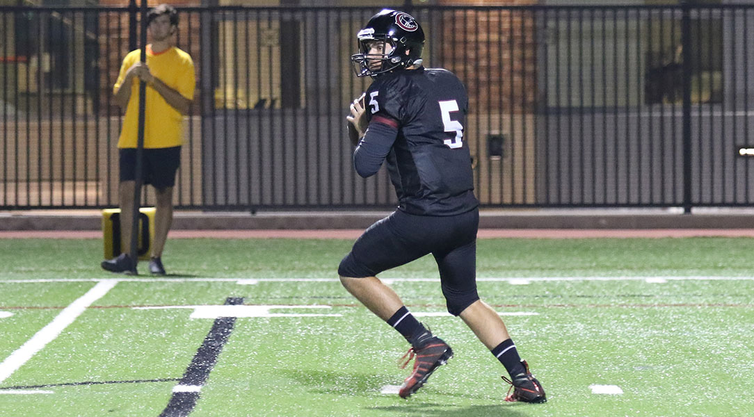 Ian Fieber winds up for a pass.