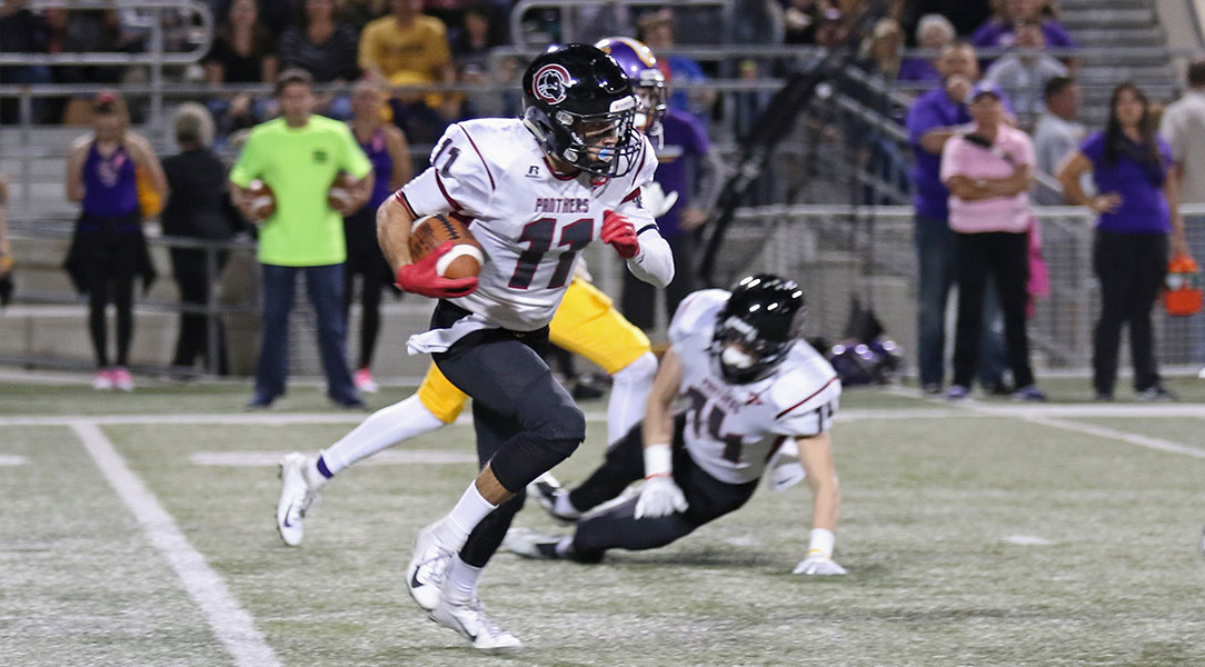 Dominic Vaccher runs toward the end zone.