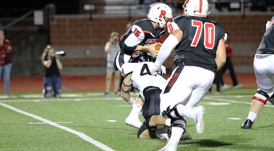 Dillon Keefe sacks the Pacific quarterback.
