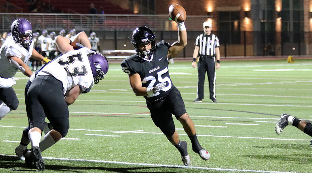 Marcos Reyes runs into the end zone.