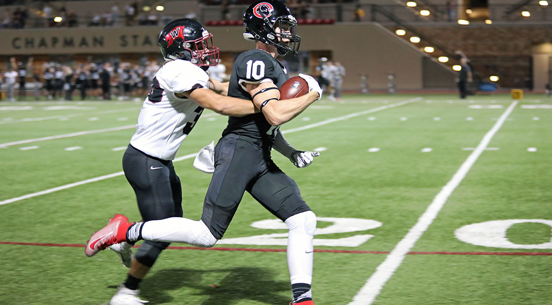 Zach Shorts sprints away from a defender.