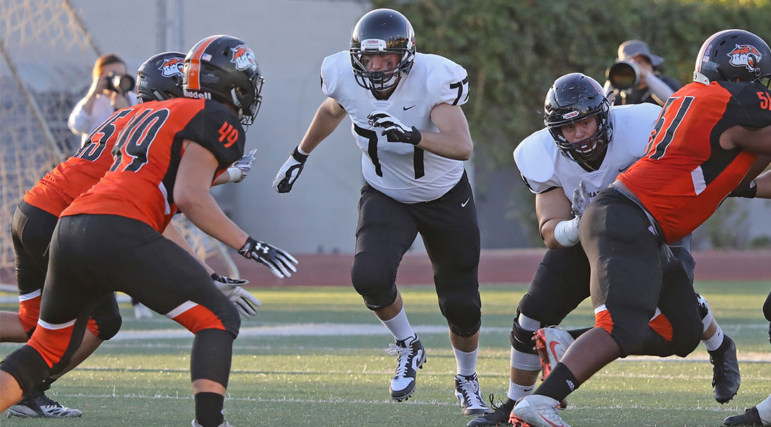 Hunter Spriggs runs to block a linebacker.