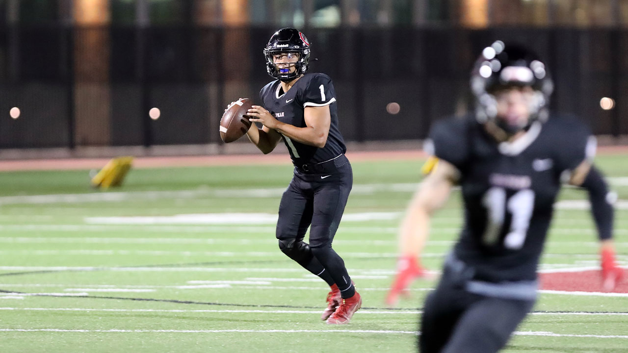 Nathaniel Espinoza looks downfield for a receiver.