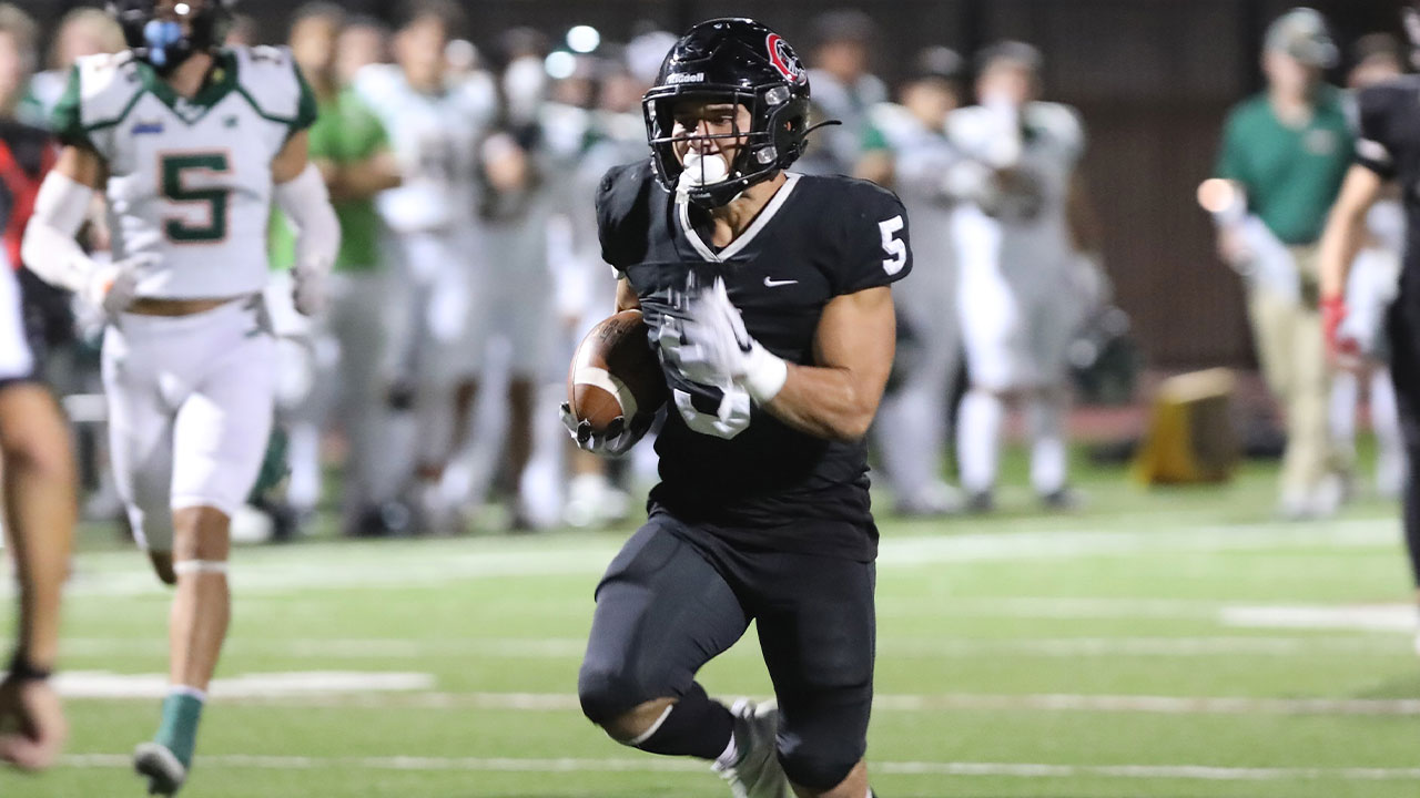 Marcos Reyes runs for a touchdown.
