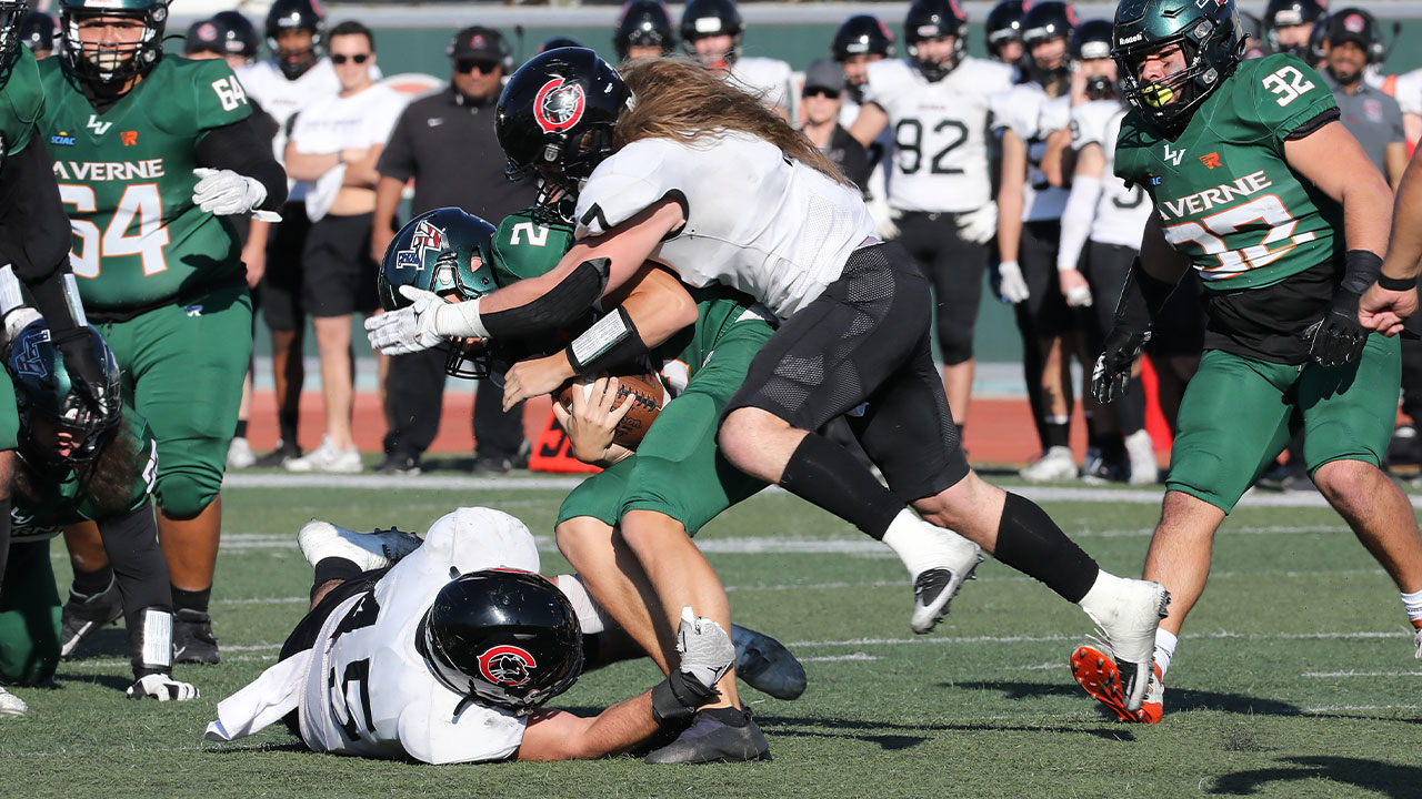 Kade Jordan jumps on to an opponent for a tackle.