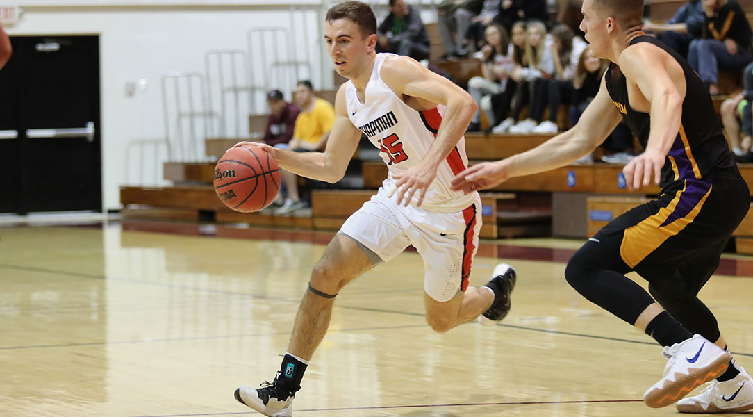 Cam Haslam drives to the basket.