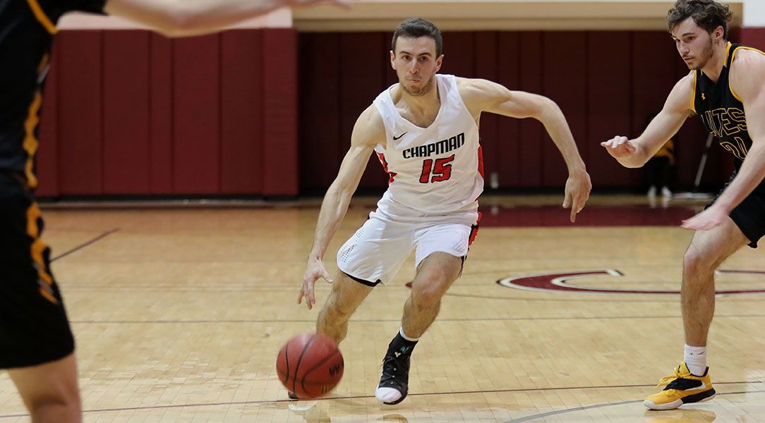 Cam Haslam dribbles past a defender.
