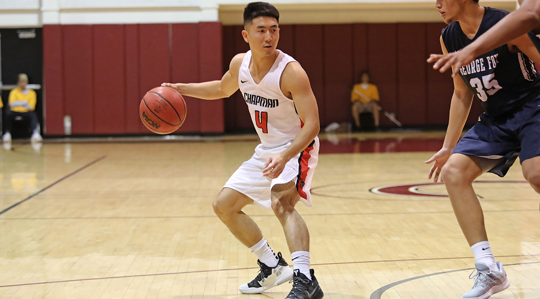 Reed Nakakihara dribbles the ball.