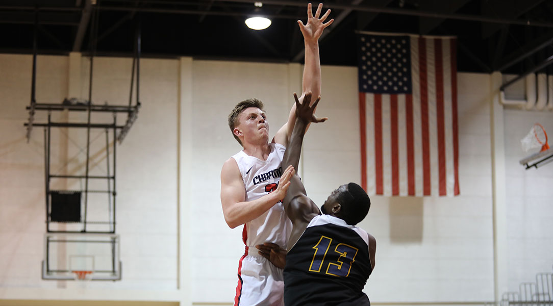 Chandler White shoots over a defender.