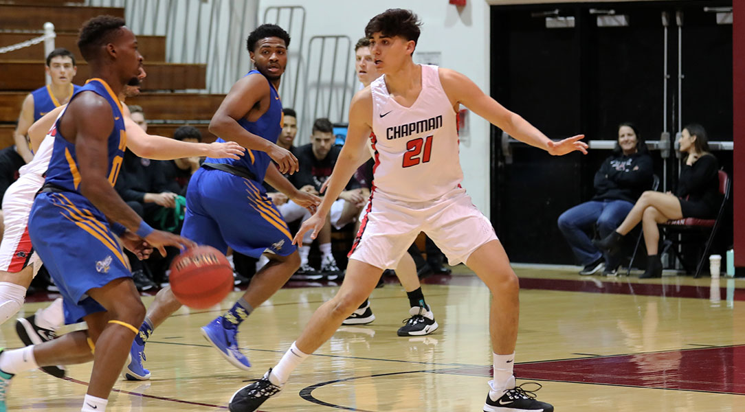 Hayden Moore defends on the perimeter.