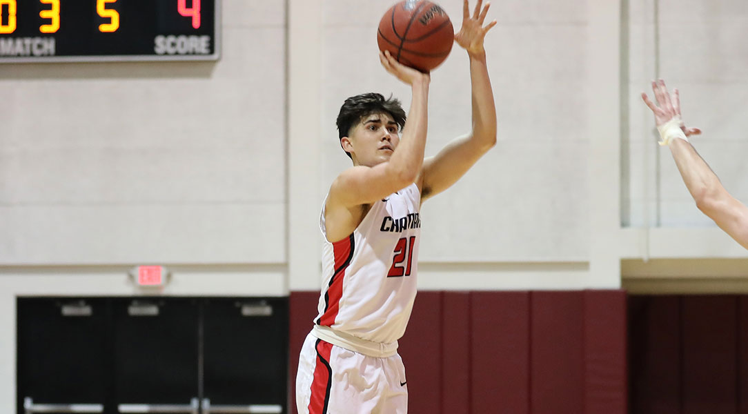 Hayden Moore shoots the basketball.