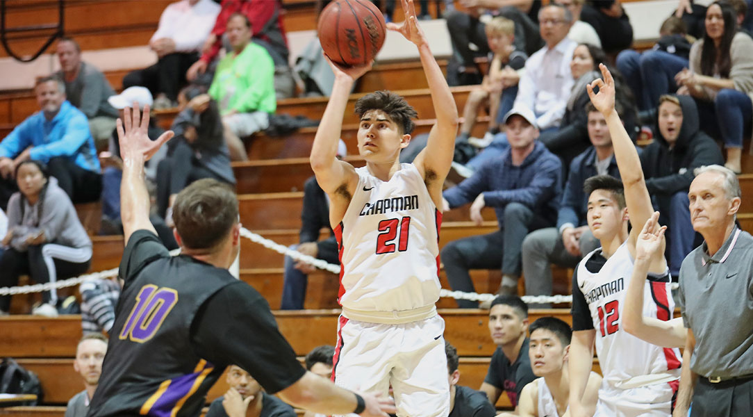 Hayden Moore shoots a three-pointer.