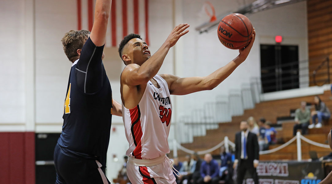 Alex Rogat drives to the basket.