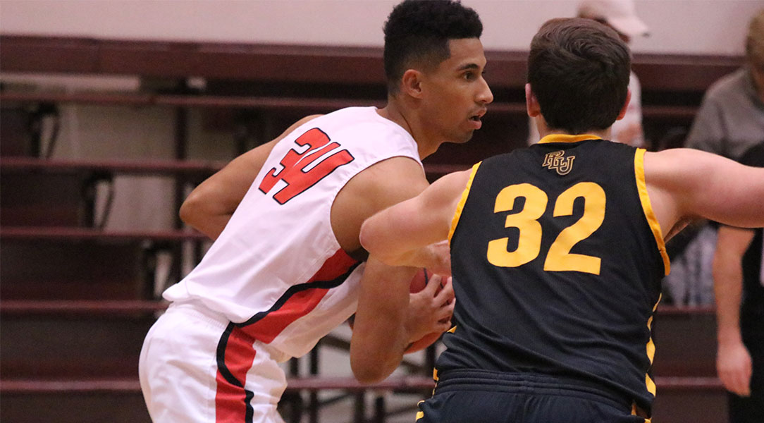 Alex Rogat looks for a lane while being defended.