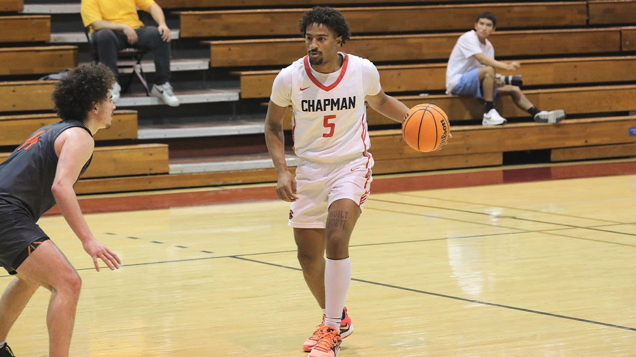 Anthony Smith dribbles the basketball.