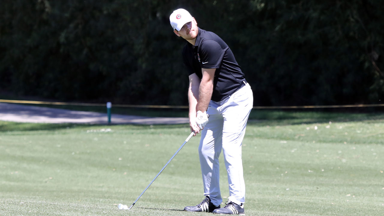 Charlie Shumway readies to hit a ball on the fairway.