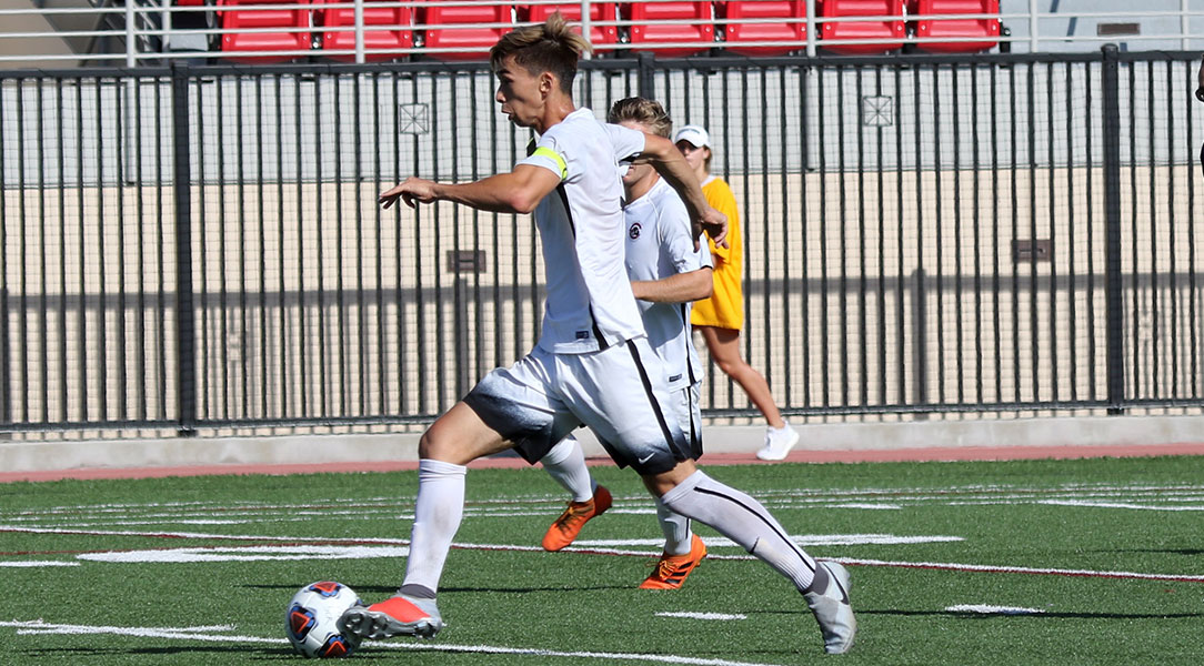 Kai Howe dribbles down the field.