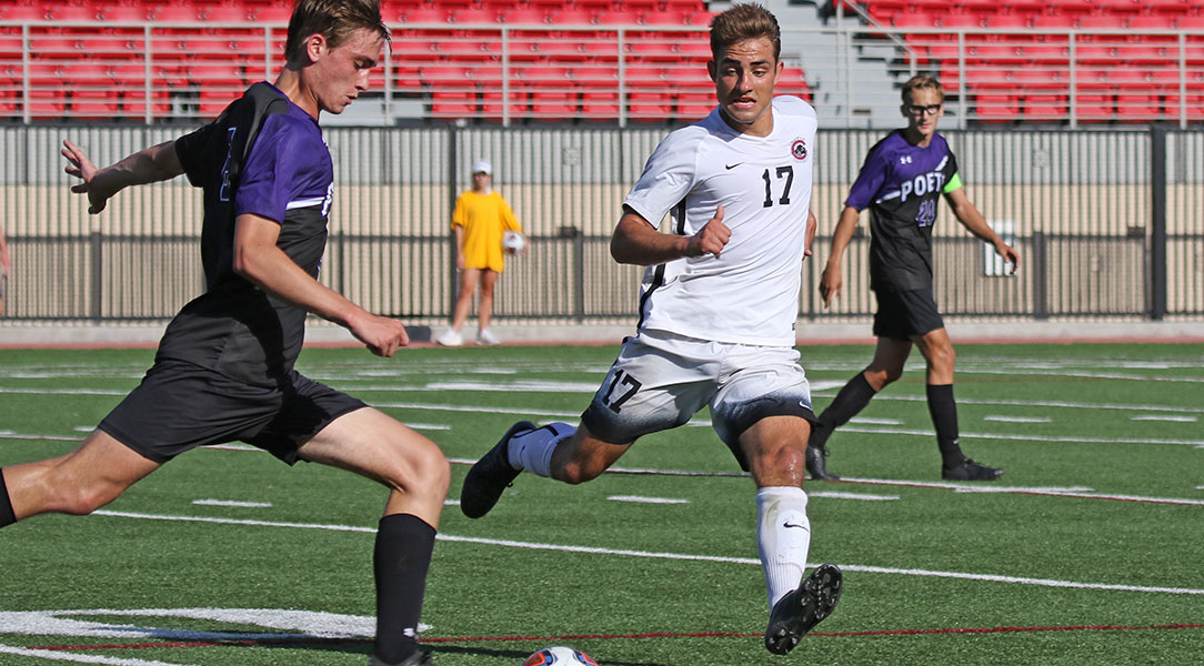 Ryan Onart defends the player with the ball.