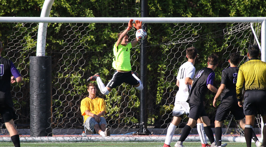 Chandler Siemonsma makes a jumping save.