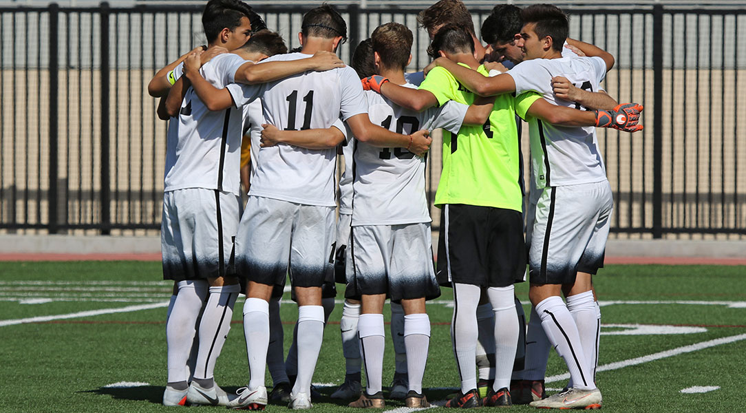The team huddles before the match.