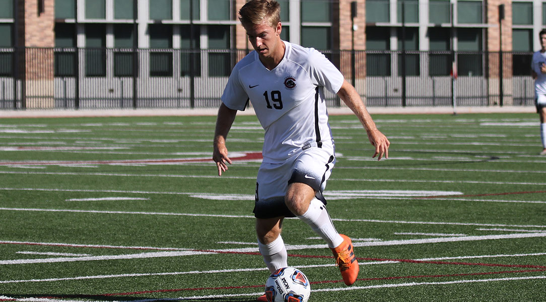 James Tribbey dribbles the ball.