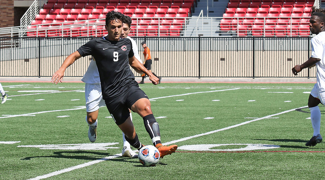 Max Wilson keeps the ball away from the defender.