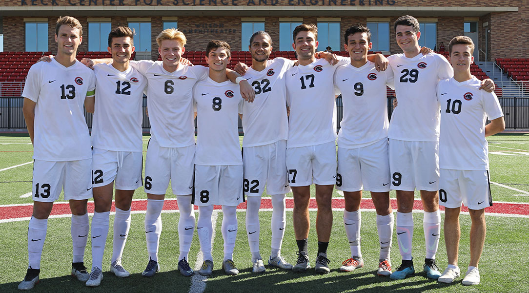 The men's soccer seniors pose for a photo.