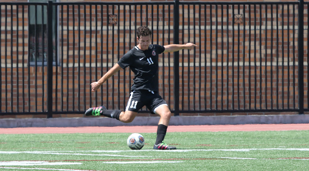 Aidan Wall takes a free kick.