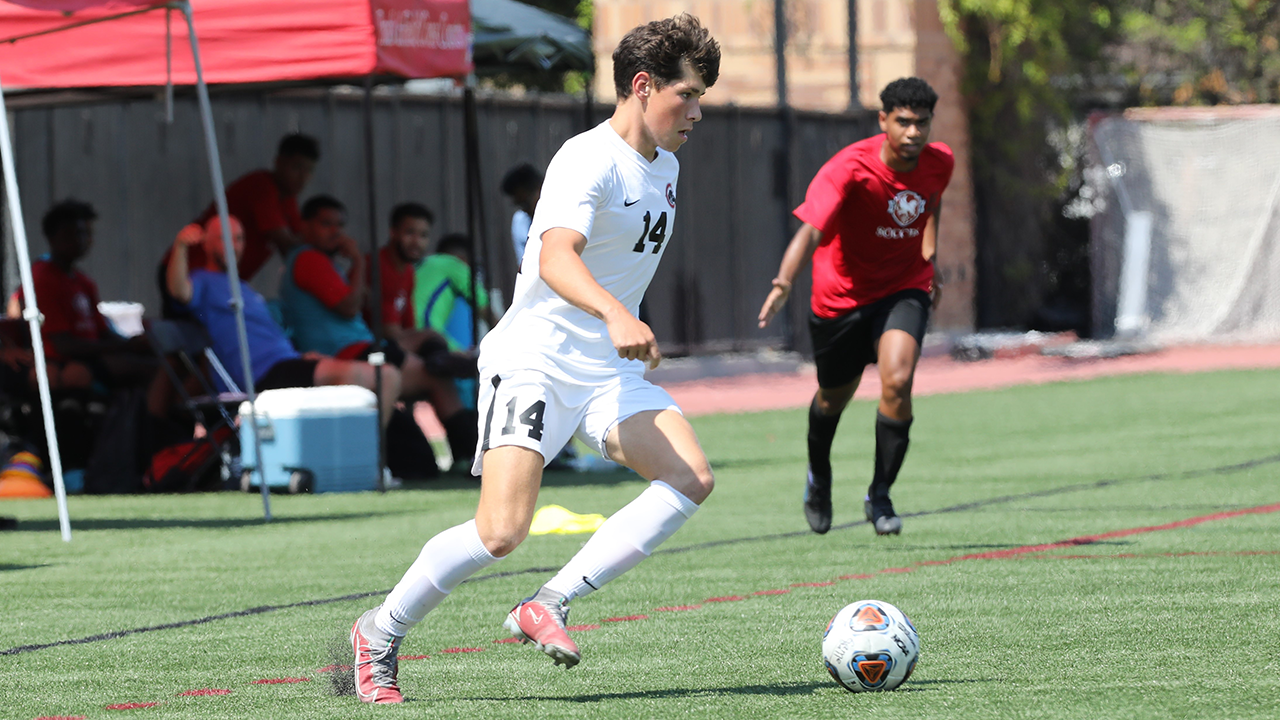 Paine kicks the ball.