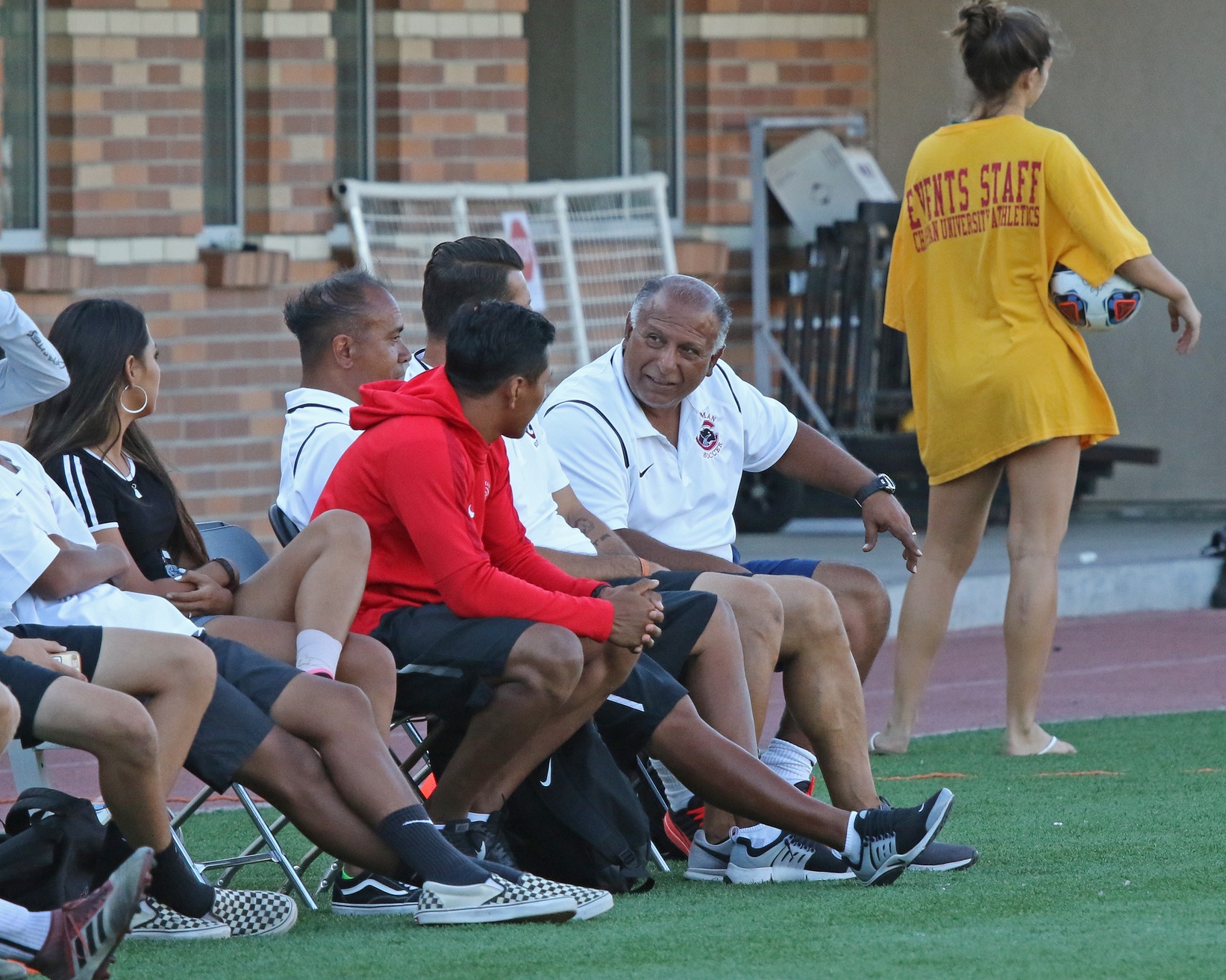 Eddie Carrillo talks to other coaches.