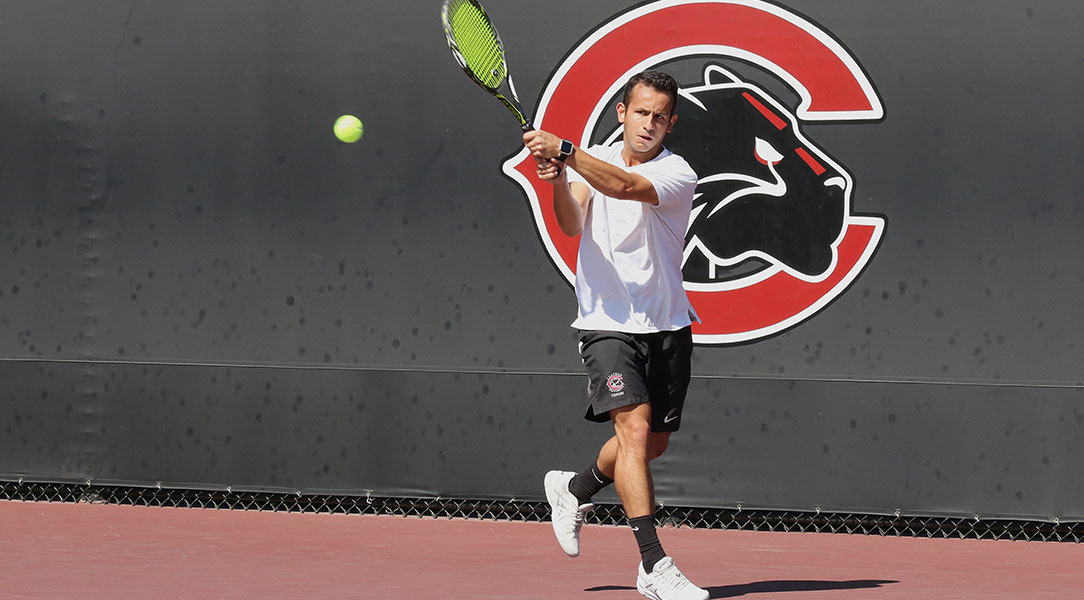 Igor Belineli hits a backhand.