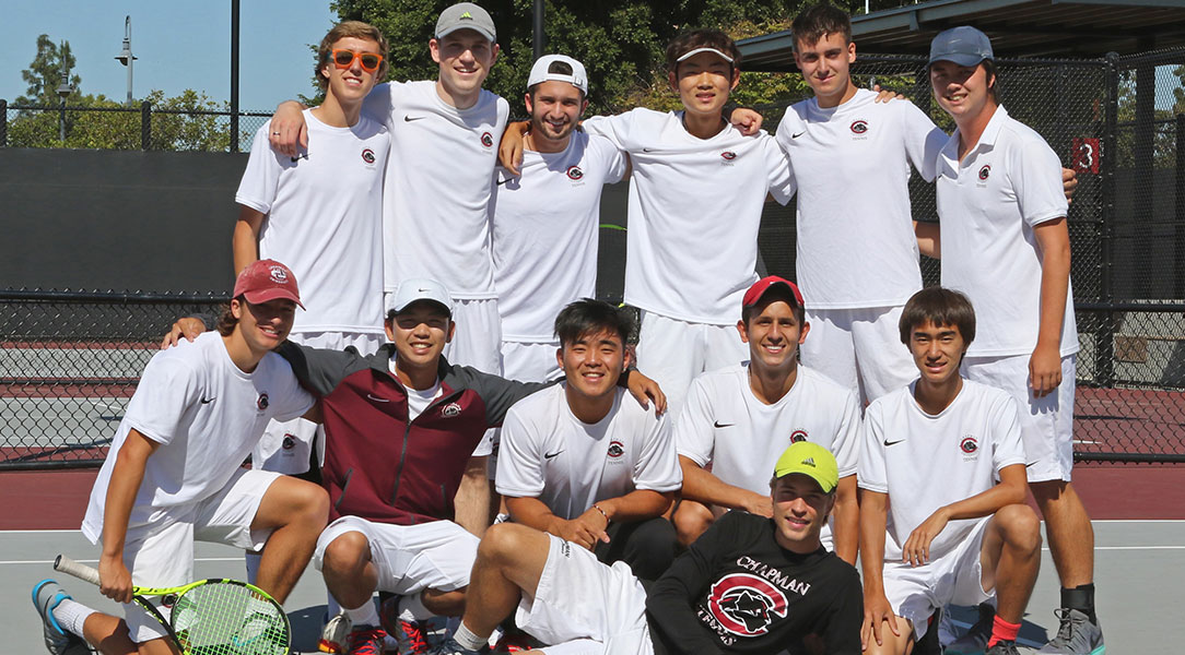 The men's tennis team poses with senior Rasmus Helms.