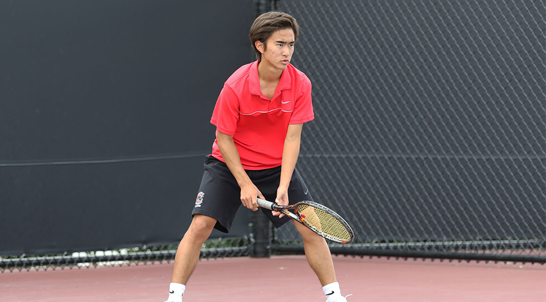 Len Kamemoto waits for a serve.