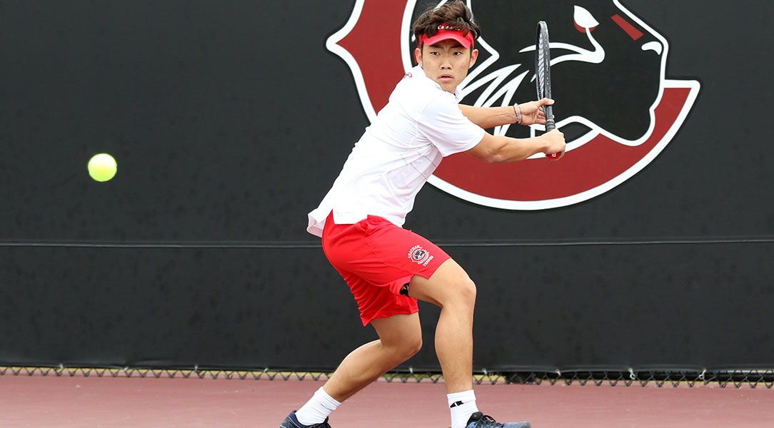 Jacob Lee hits a back-hand shot.