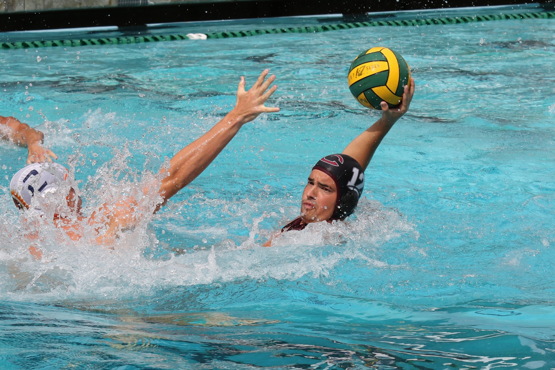 Vasil Halchev avoids a defender while looking for a pass.
