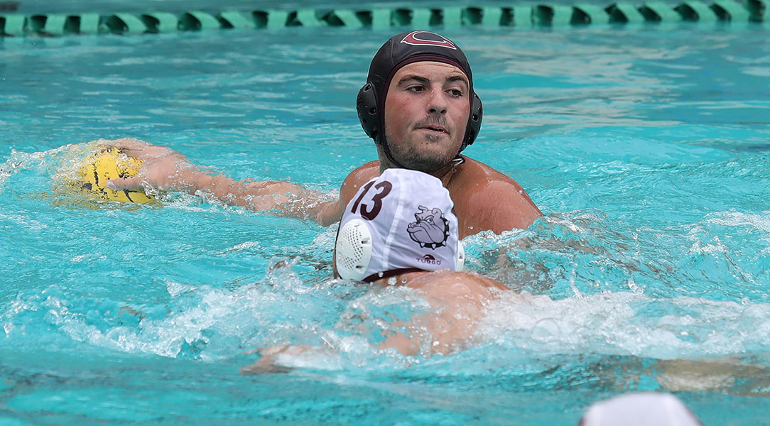 Evan Belli looks for a teammate to pass to.
