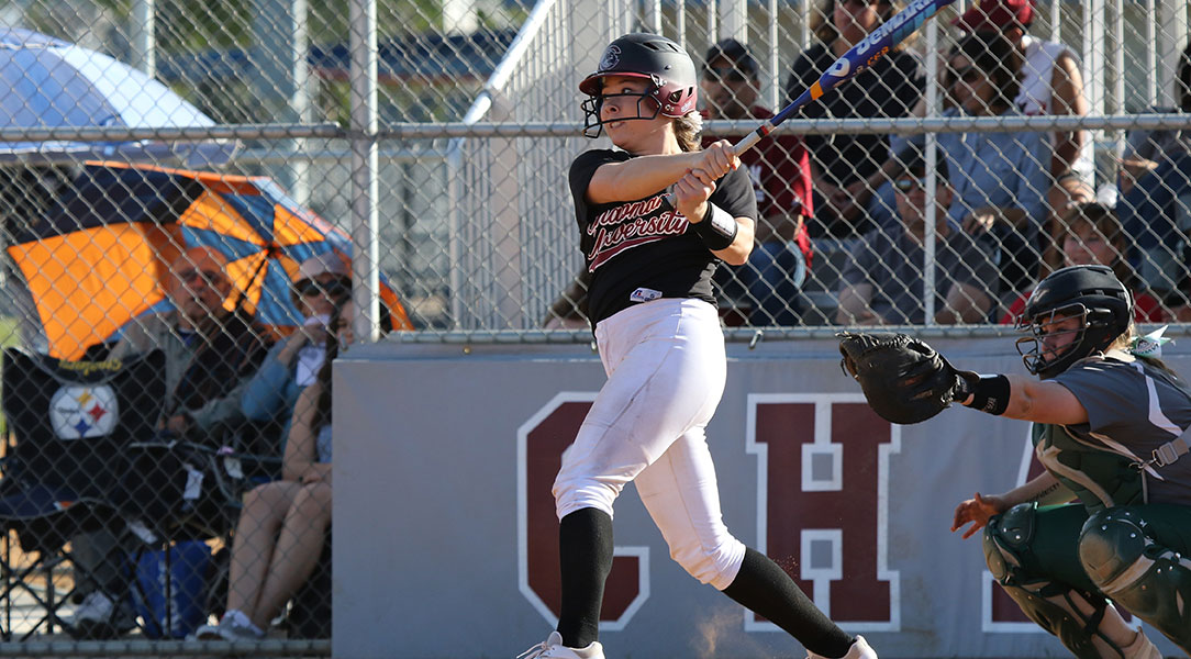 Sarah Taketa finishes her swing after getting a hit.