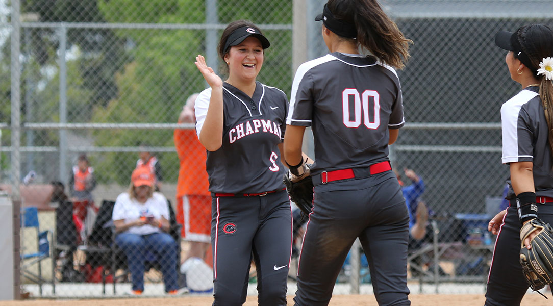 Sarah Hartmann high fives a teammate.